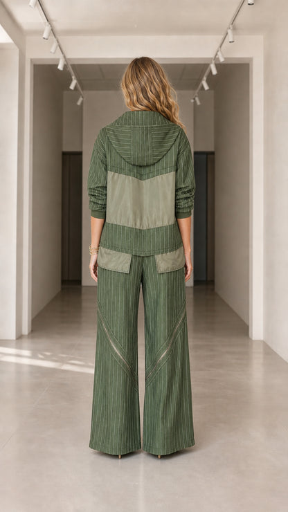 Back view of model showing hood and rear pockets of olive green pinstripe tracksuit set