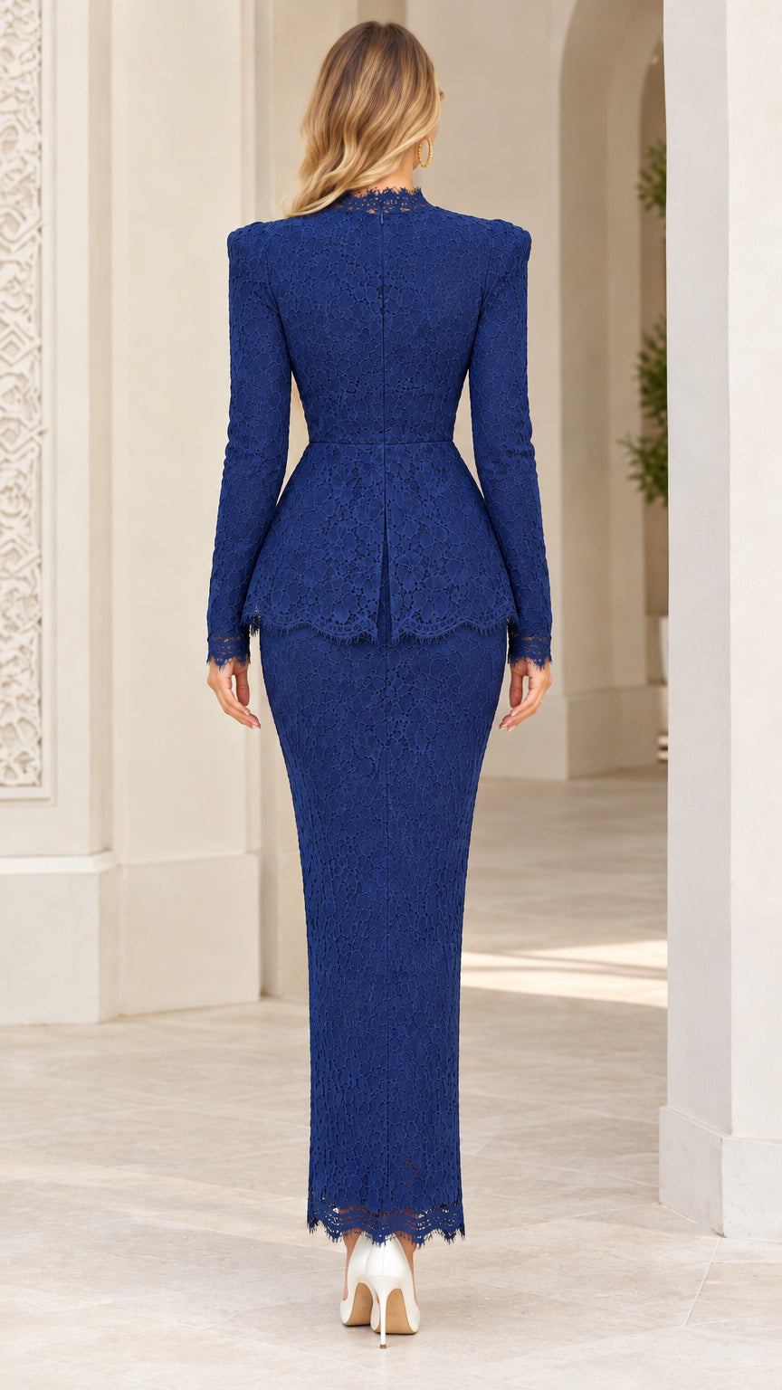 Back view of model wearing royal blue full lace peplum maxi gown