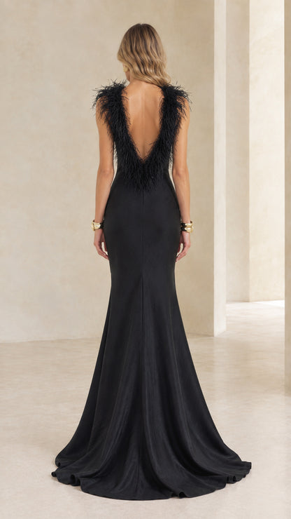 Black mermaid evening dress showing deep V-back with feather trim and train