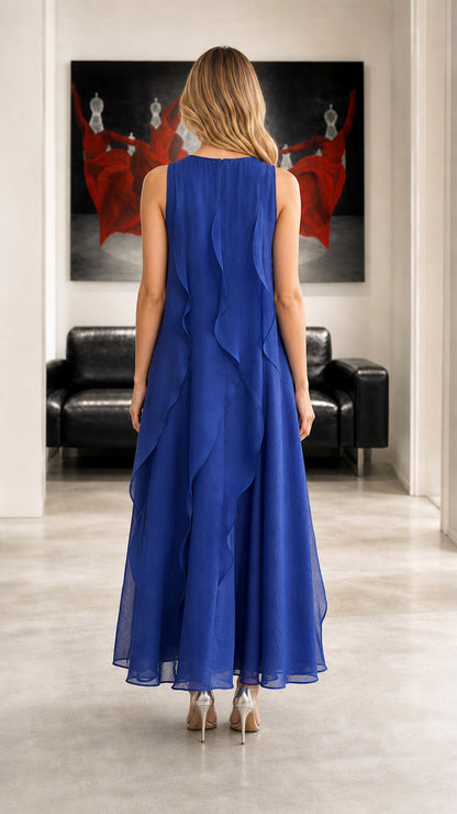 Back view showing cascading ruffles on royal blue maxi dress