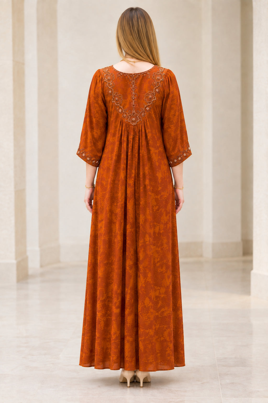 Back view of Rust Orange maxi dress showing detailed embroidered back yoke