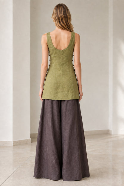 Back view of model in olive green scoop-back sleeveless tunic and wide-leg trousers