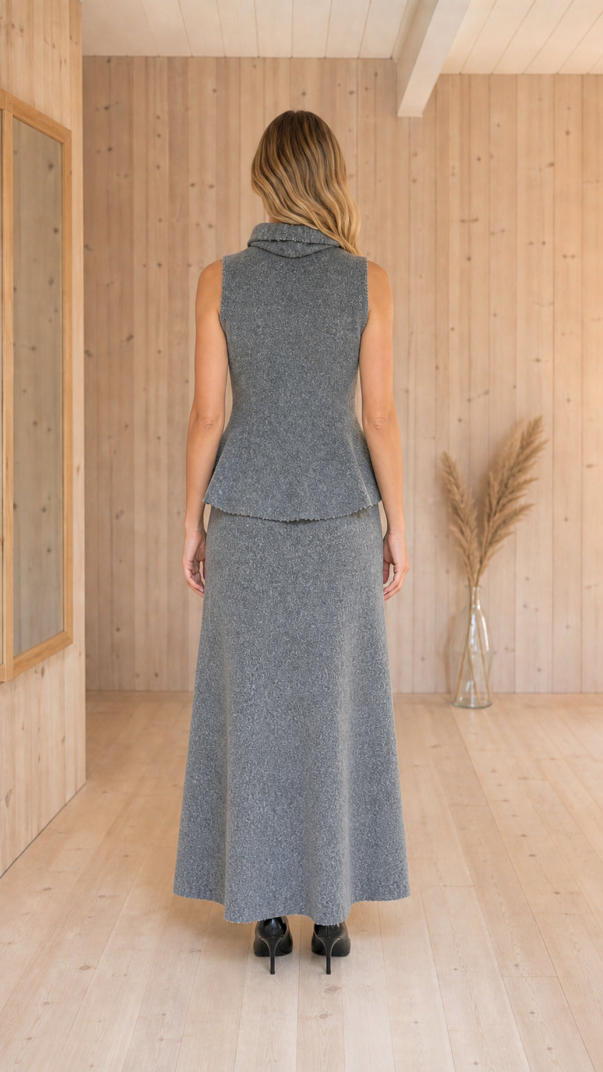 Back view of Heather Grey two-piece knit peplum top and maxi skirt