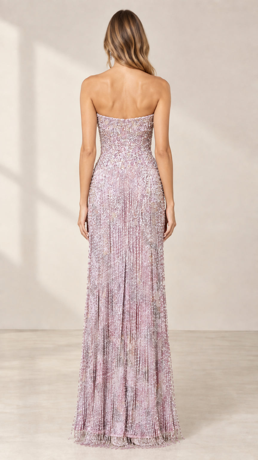 Back view of model wearing lilac strapless beaded formal gown