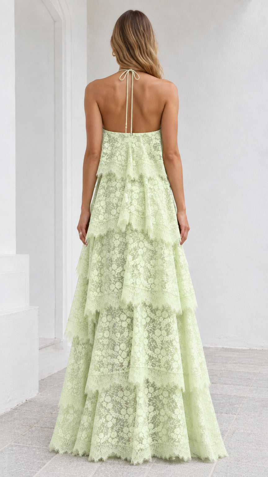 Back view of Mint Green lace halter maxi dress with tie straps and open back