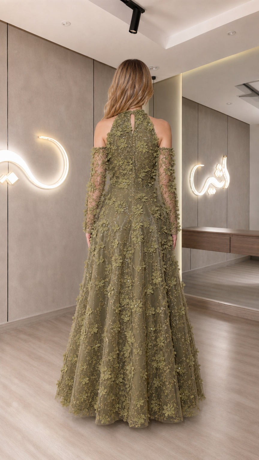 Back view of model in olive green formal gown with halter neckline and cold shoulder detail