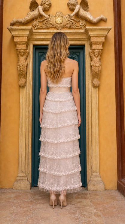 Back view of champagne strapless maxi dress