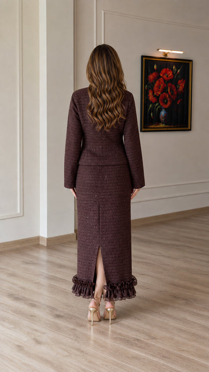 Back view of chocolate brown tweed suit showing back slit on maxi skirt