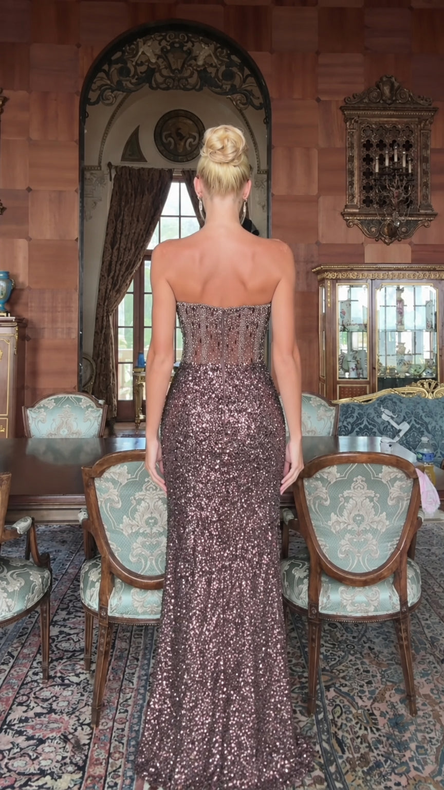 Back view of model in mocha brown strapless corset sequin gown with sheer boned back