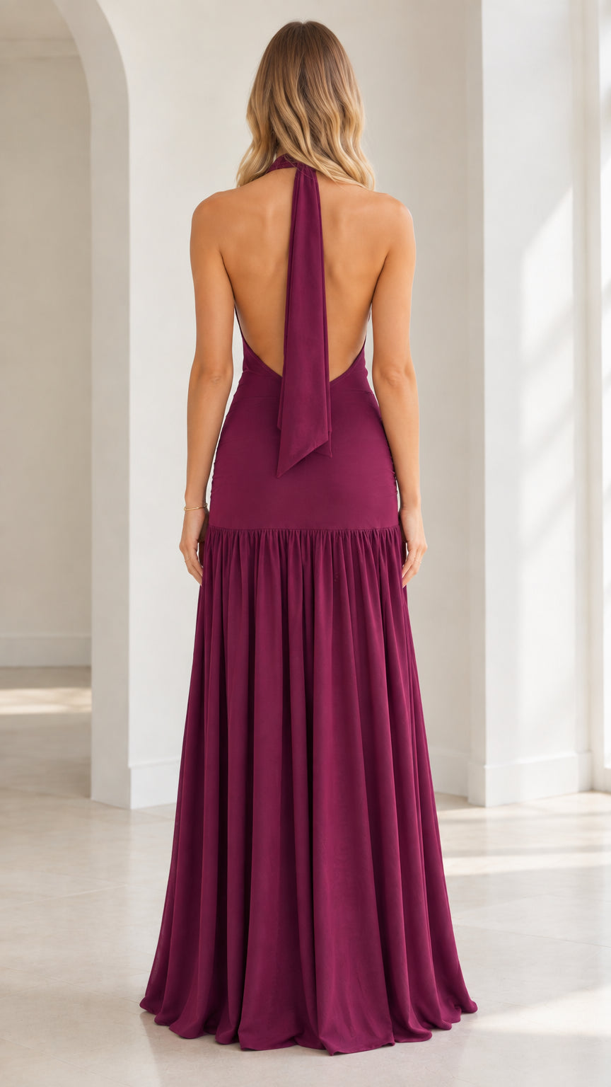 Burgundy backless halter evening gown back view with trailing neck sash