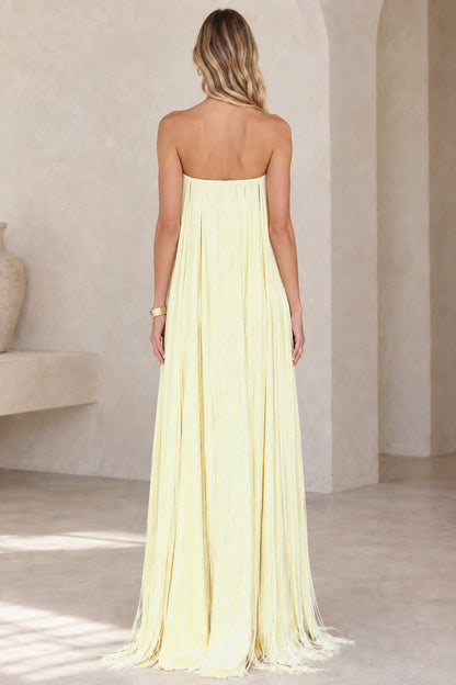 Back view of strapless butter yellow maxi dress with back zipper detail