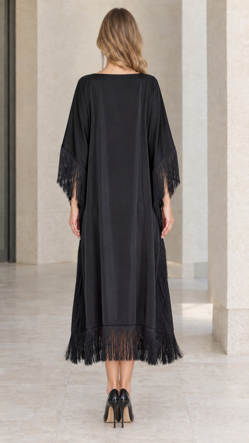 Back view of black satin midi kaftan dress with fringe hem