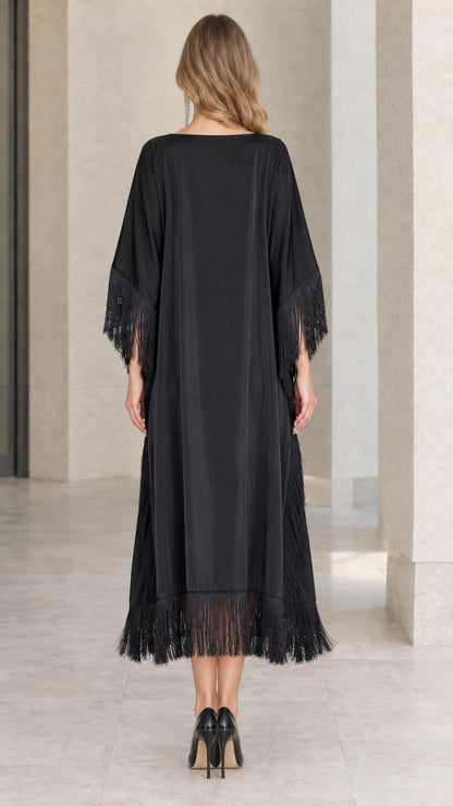 Back view of black satin midi kaftan dress with fringe hem