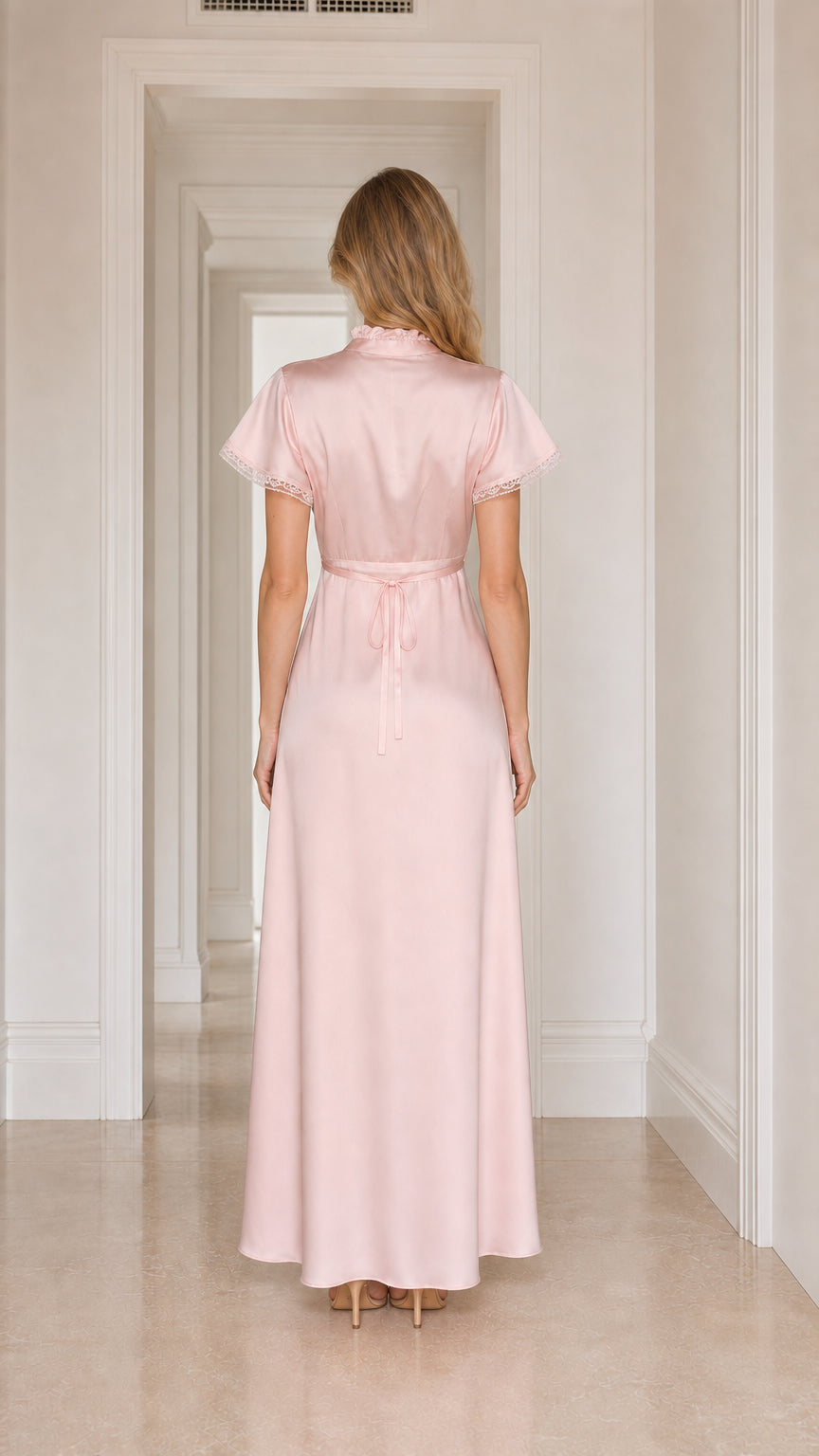Model wearing pink satin lace-trim maxi dress, back view