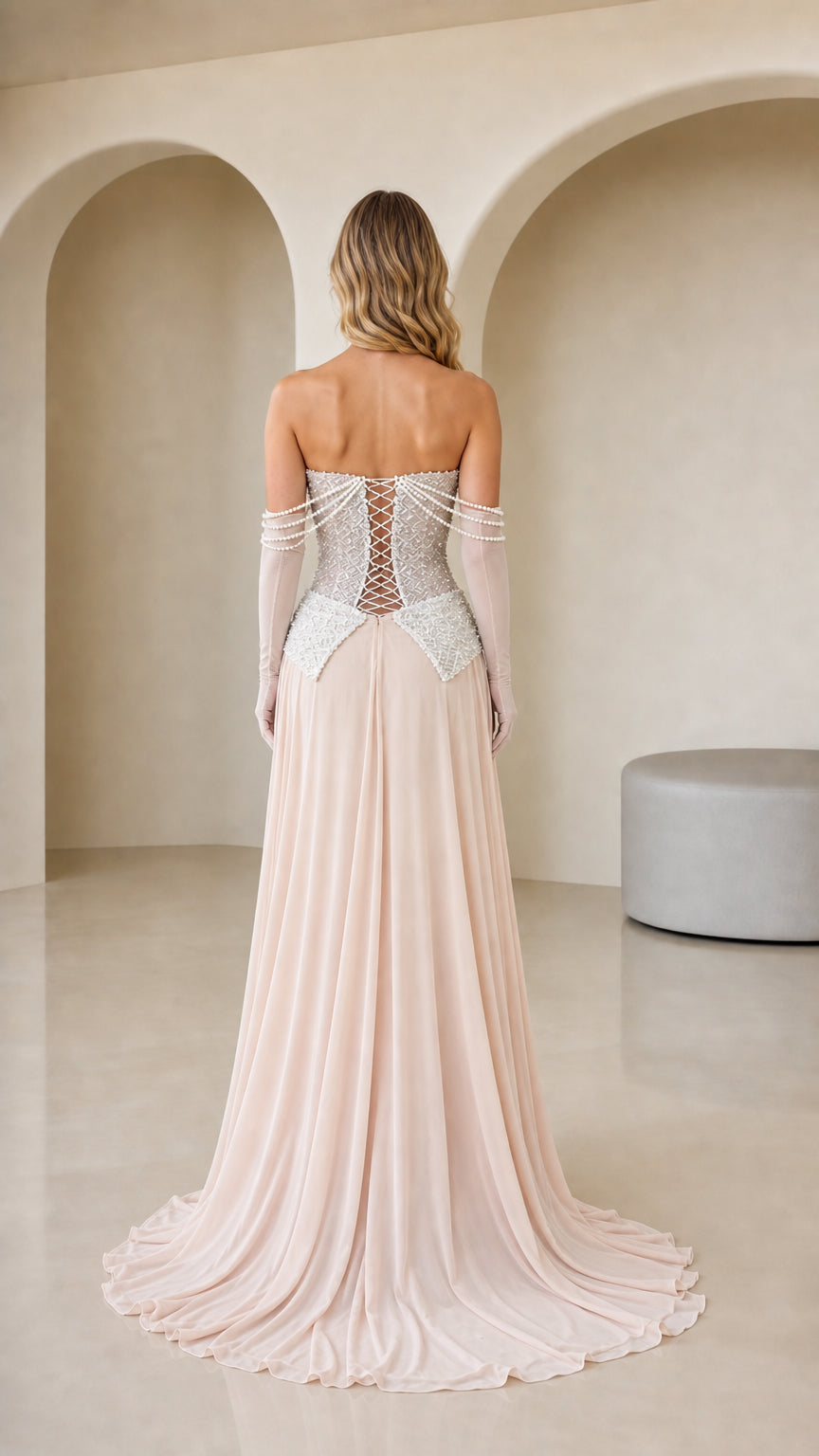 Back view of Blush Pink formal dress highlighting the adjustable corset lace-up closure