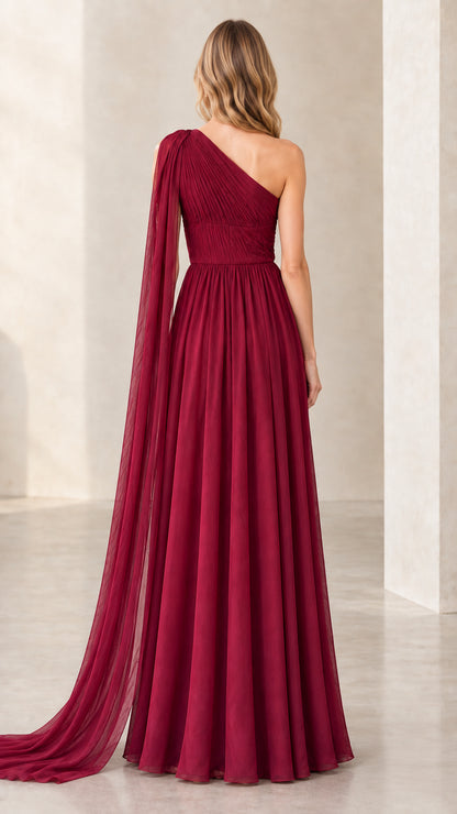 Burgundy one-shoulder chiffon formal gown back view with flowing cape