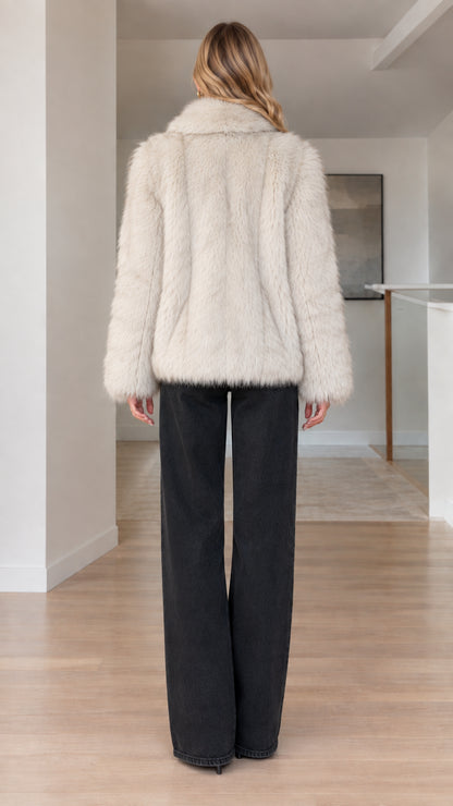 Back view of cream plush faux fur coat with relaxed fit