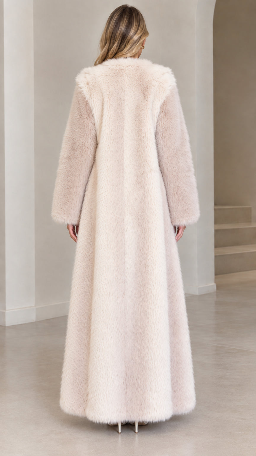 Back view of sweeping cream plush faux fur maxi overcoat