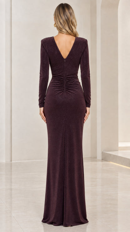 Back view of model in burgundy long sleeve evening dress showing deep V-back and ruching
