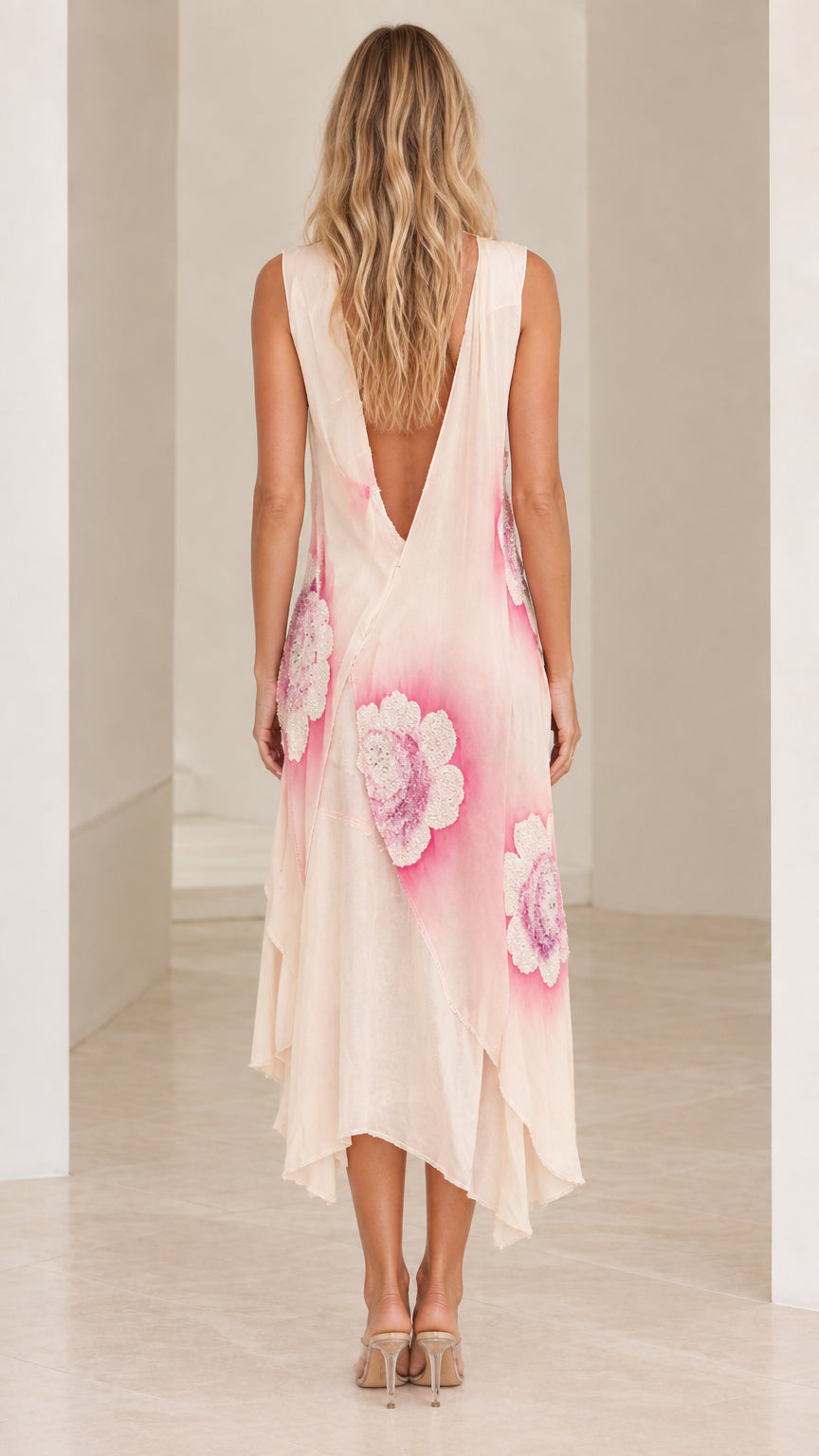 Back view of model showing low back detail on Blush Pink midi dress