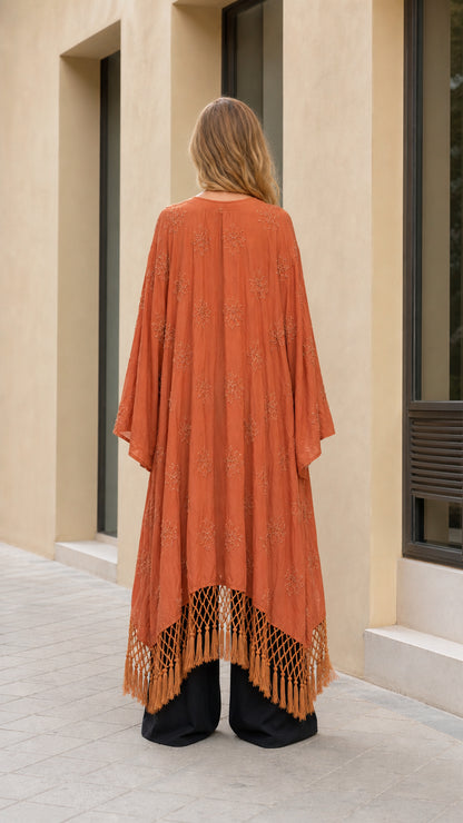 Back full view of terracotta embroidered kimono duster highlighting fringed hemline