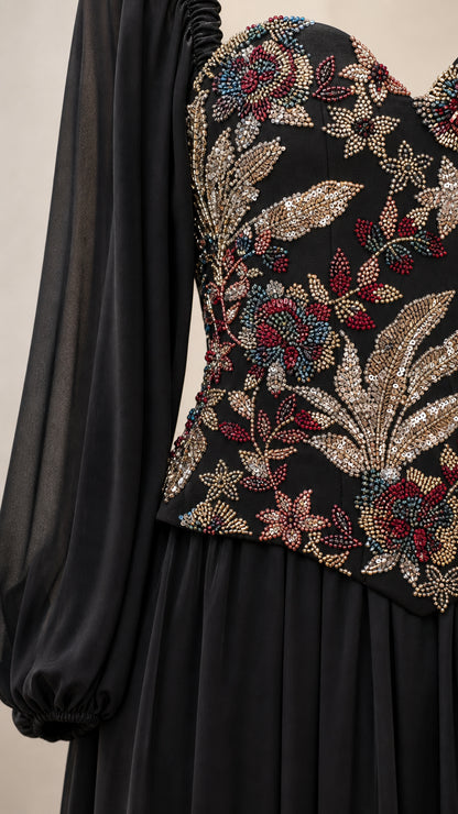 Close-up detail of intricate floral beading and embroidery on the corset bodice