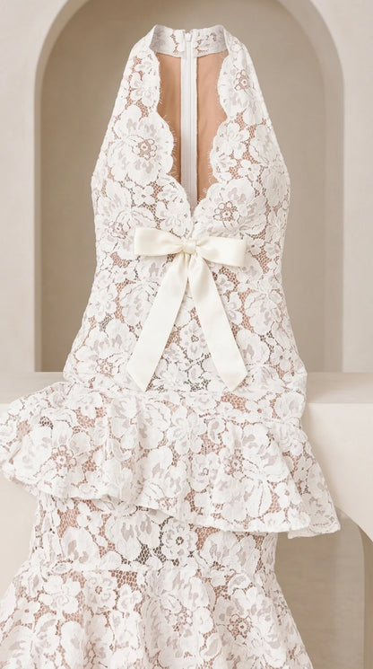 Close-up detail of White halter floral lace neckline and front ribbon bow