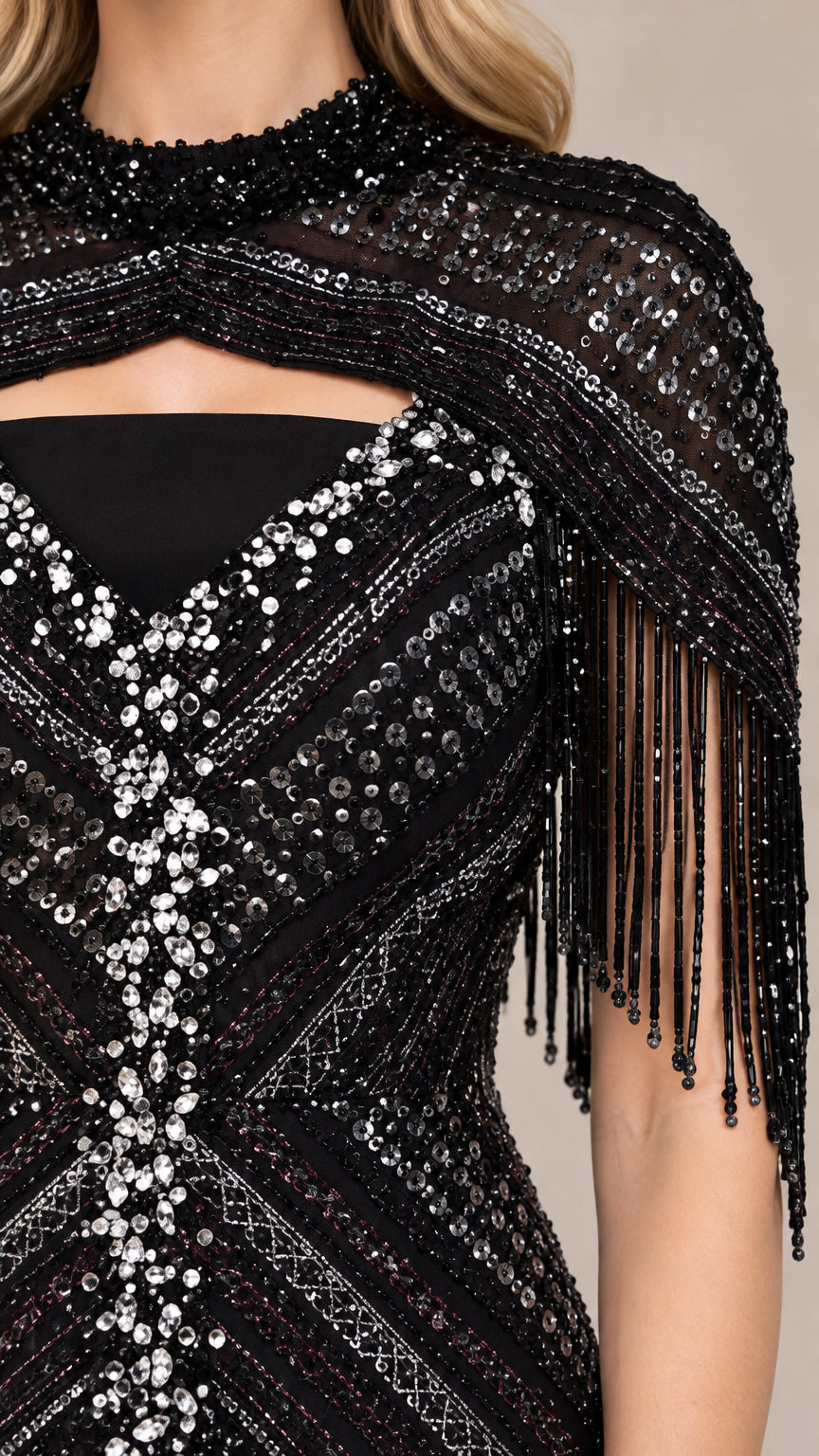 Close-up detail of high neckline, cutout accent, and beaded fringe trim on black evening gown