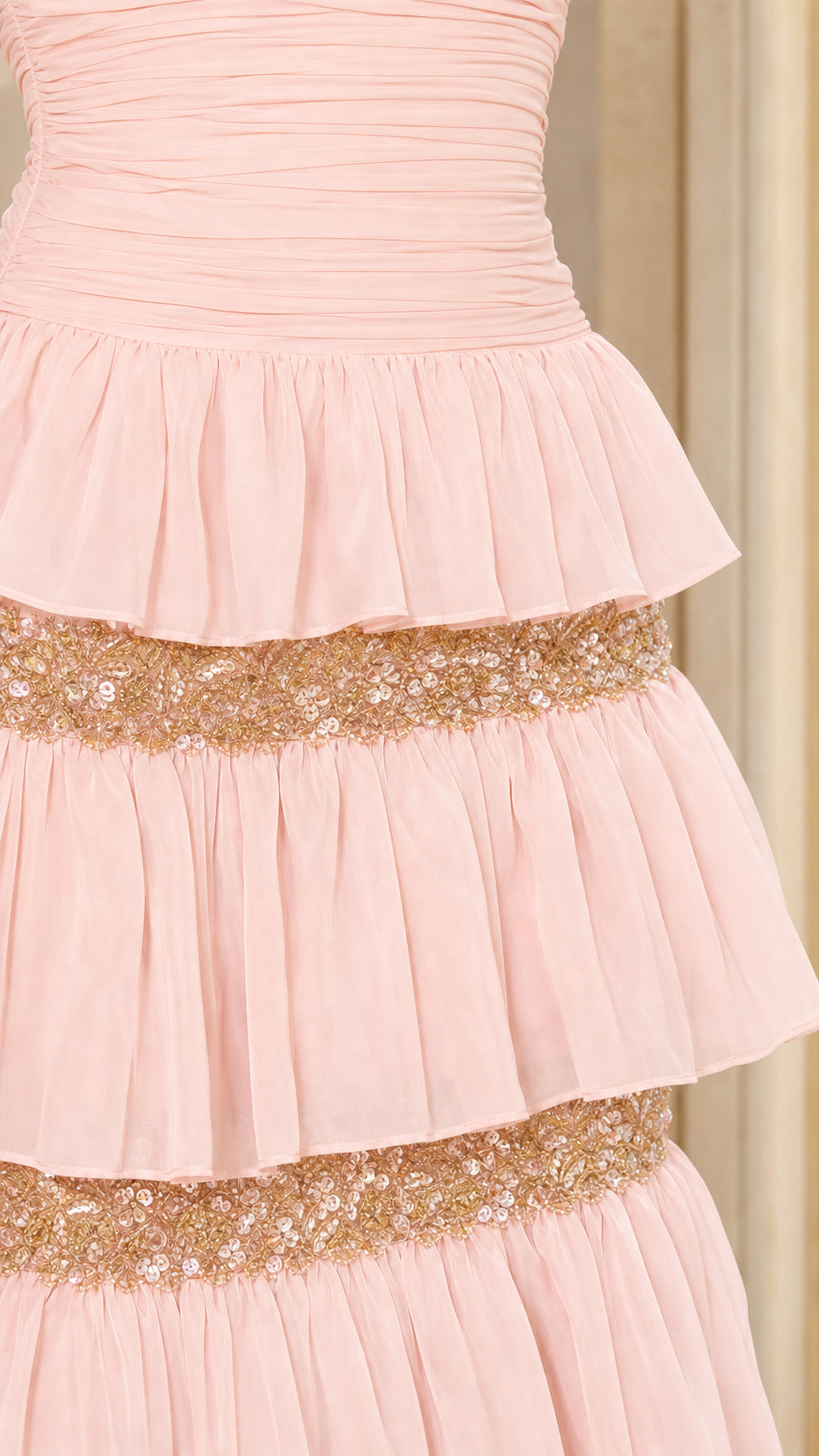 Close-up detail of ruffled tiers and sequin trim