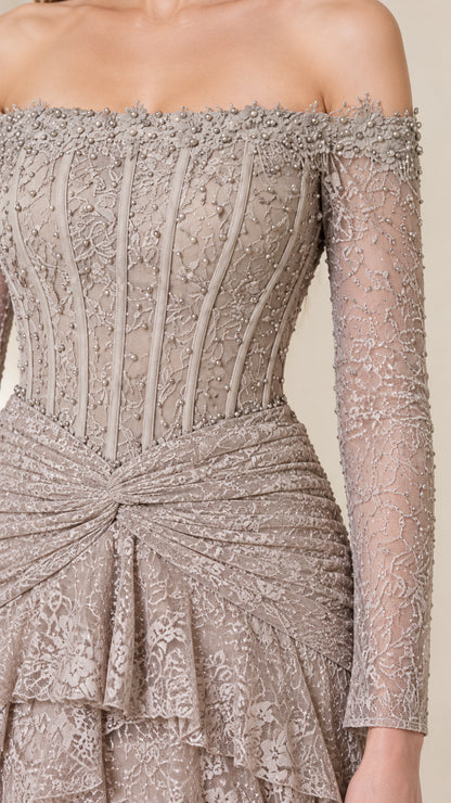 Close-up of beaded off-the-shoulder neckline, structured boned corset bodice, and draped waist