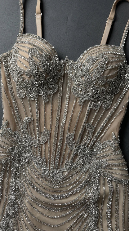 Close up detail of sparkling beadwork and structured boning bodice