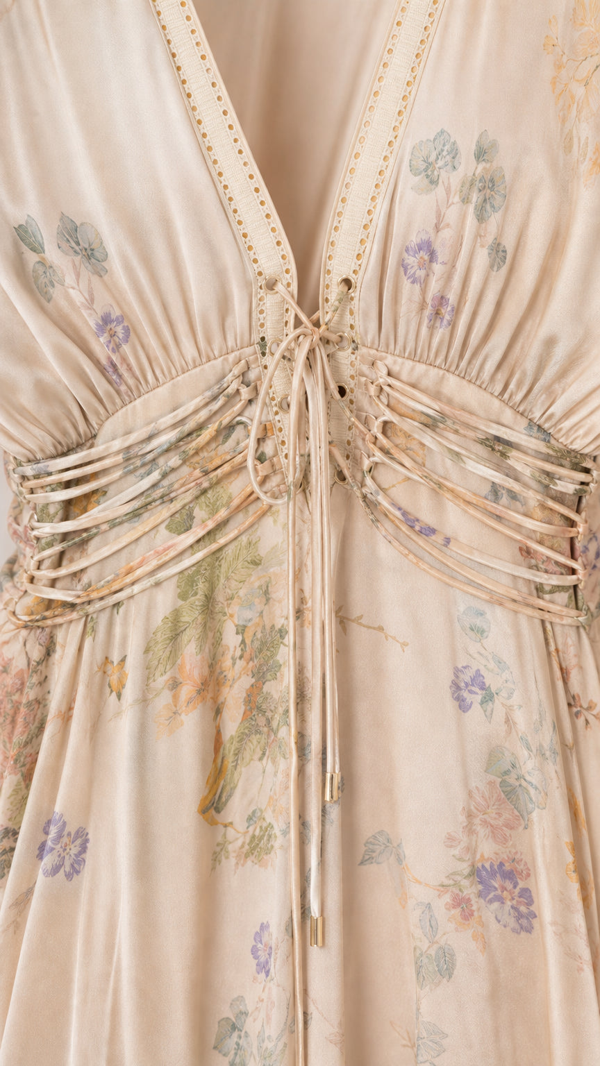 Close-up detail of lace-up corset waist and V-neckline
