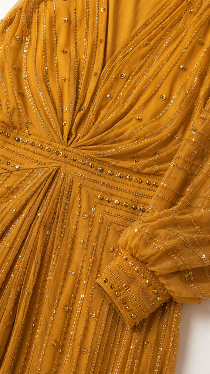 Close-up detail of bodice, neckline, and sleeve cuffs with bead embellishments
