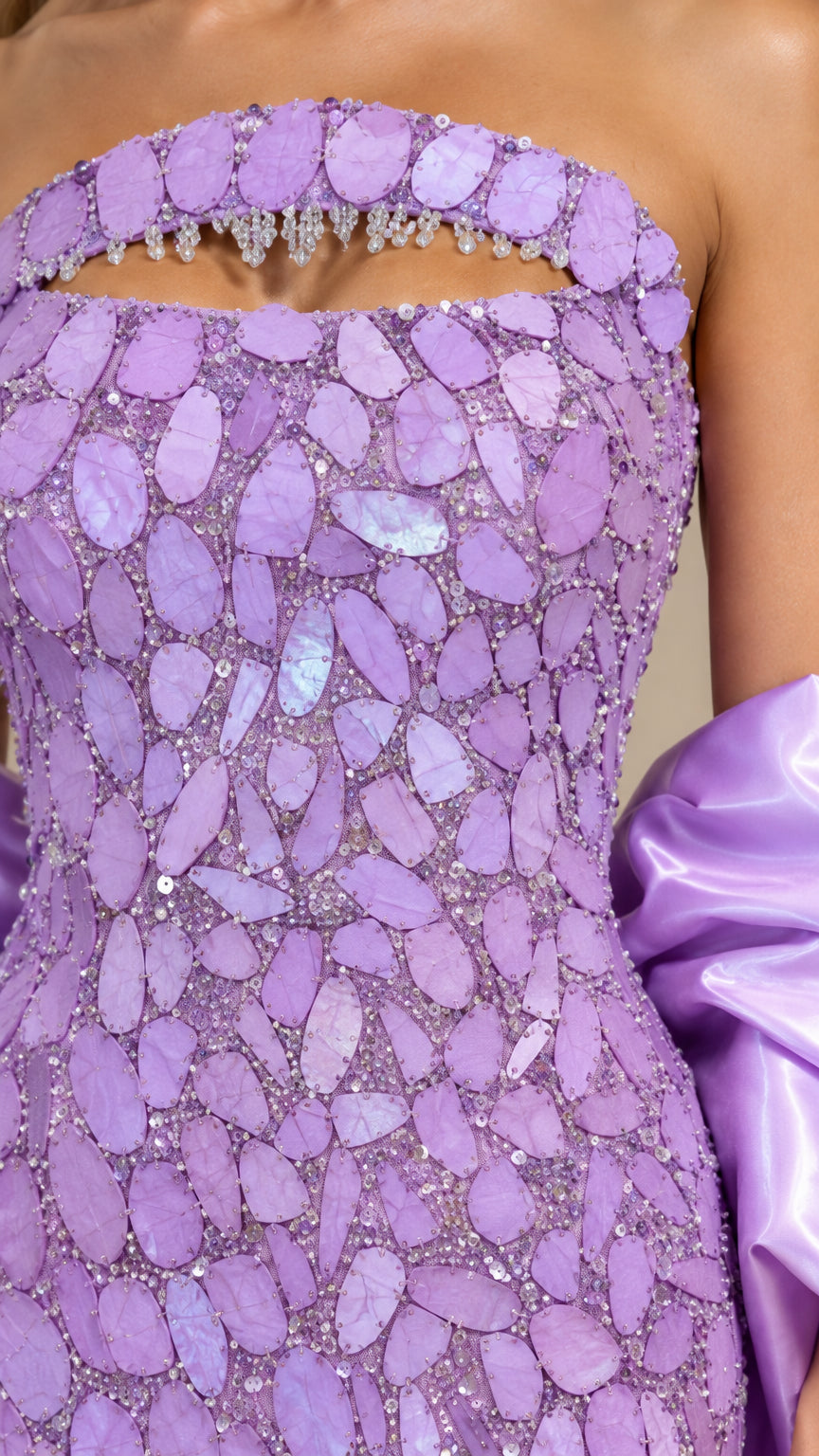 Close-up detail of Lavender dress neckline cutout with crystal fringe and textured sequins