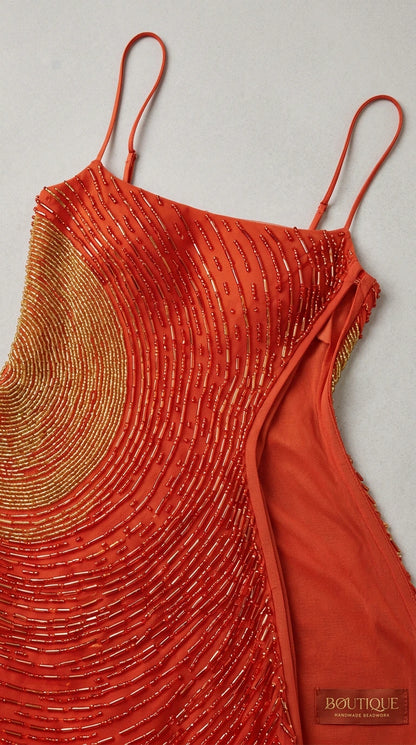 Close-up detail of intricate beadwork, spaghetti straps, and interior lining
