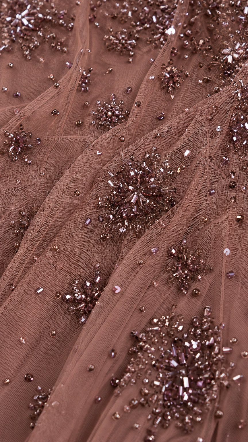 Close-up of intricate bead and sequin mesh fabric detail