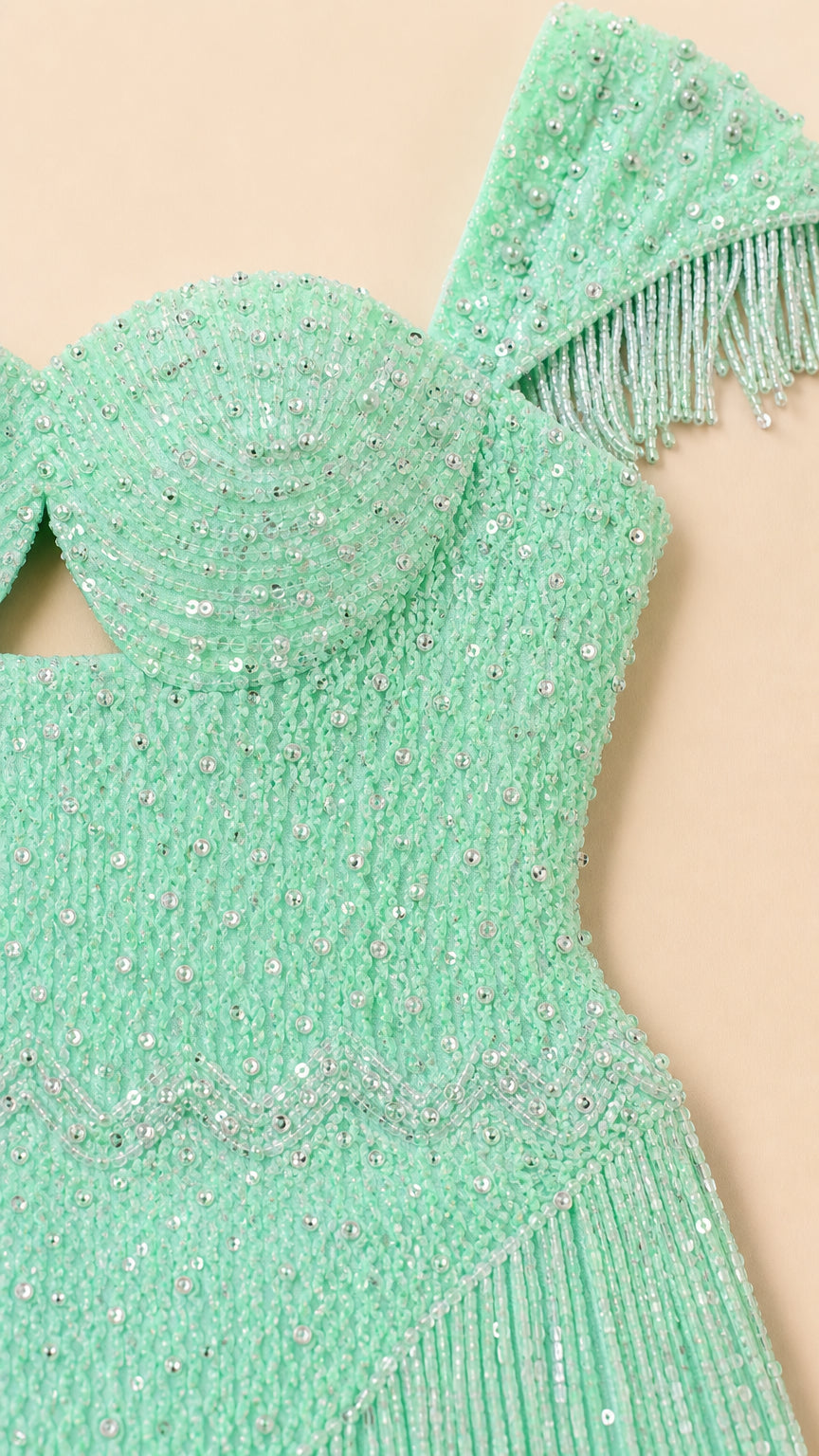 Close-up detail of Mint Green sequin embroidery and beaded fringe trimming