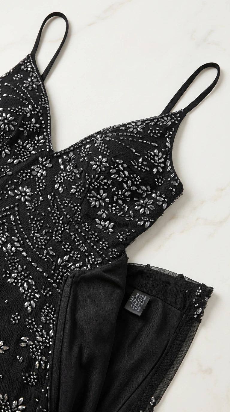 Close-up detail shot of intricate sequin and beadwork on black bodice