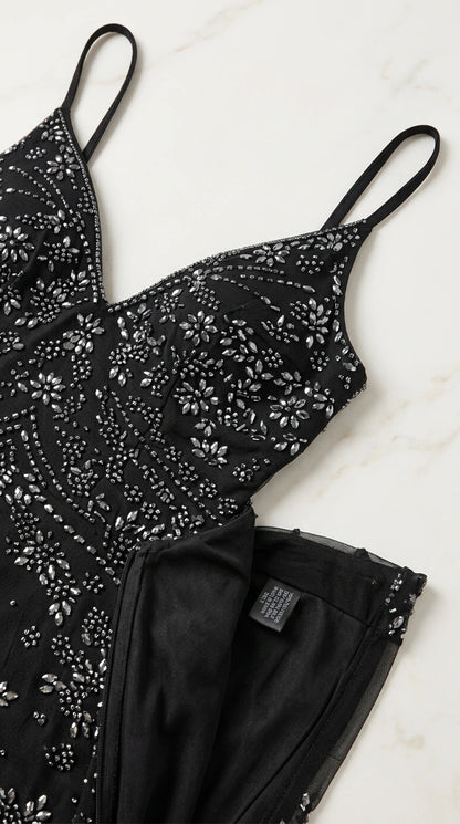 Close-up detail shot of intricate sequin and beadwork on black bodice