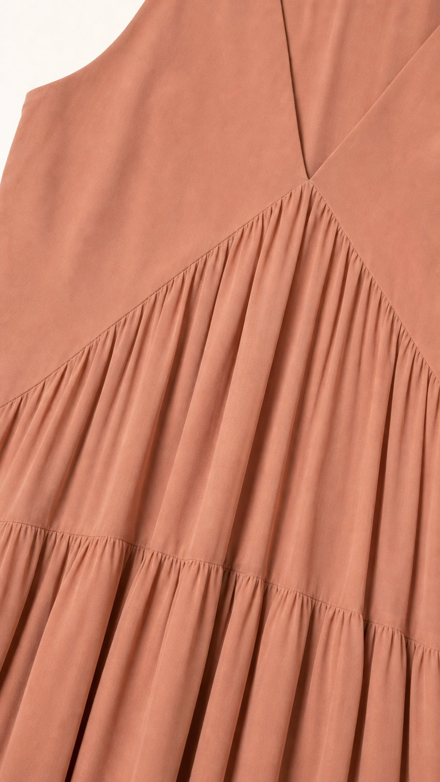 Close-up detail of the gathered bodice and tiered fabric texture