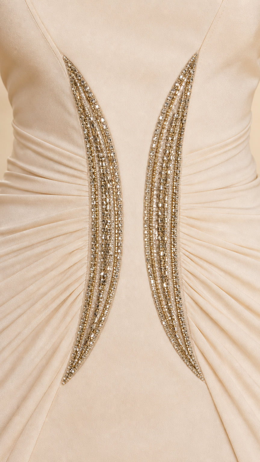 Close-up detail of crystal embellishment and ruching at the waist