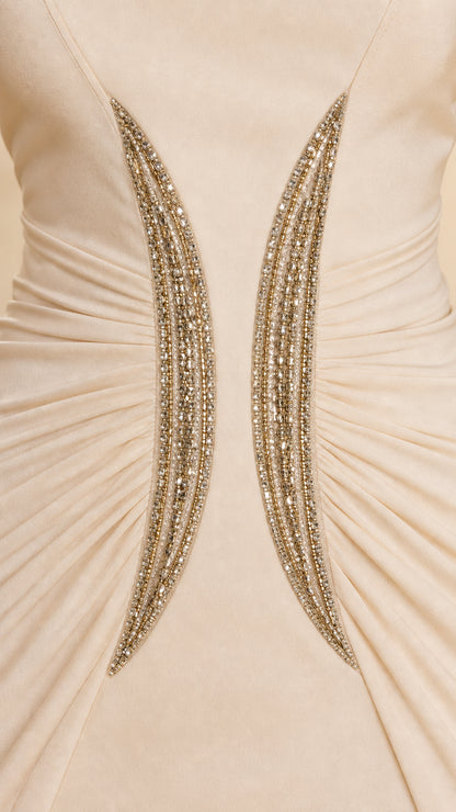 Close-up detail of crystal embellishment and ruching at the waist