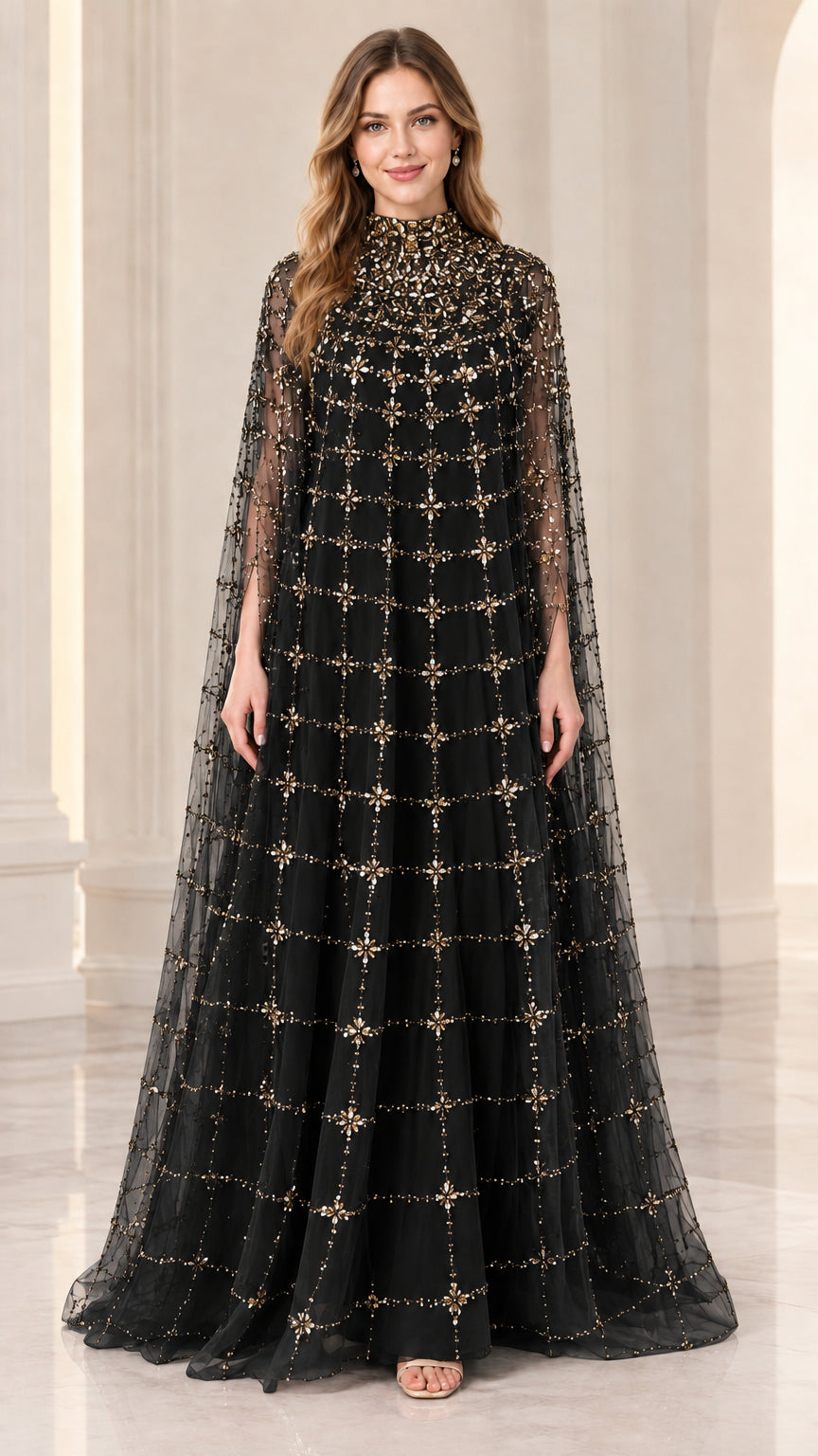 Front full view of woman wearing black beaded cape evening gown