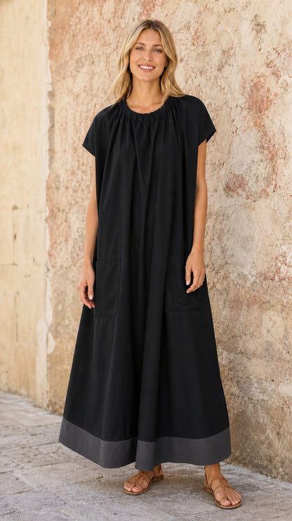 Model wearing Black relaxed maxi dress with contrast grey hem and pockets
