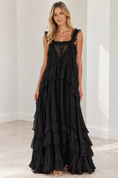 Model wearing black sleeveless tiered ruffle lace bodice maxi dress