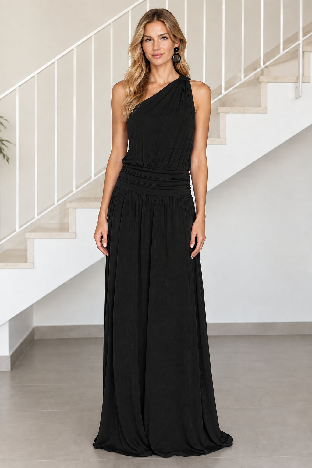 Front view of model wearing black one-shoulder ruched waist maxi dress