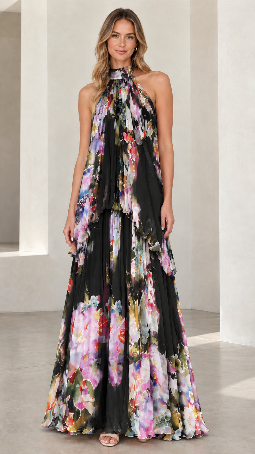 Front view of black floral print halter neck tiered evening maxi dress