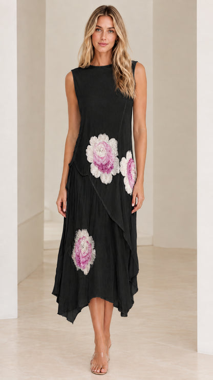 Model wearing Black sleeveless floral embroidered asymmetrical midi dress