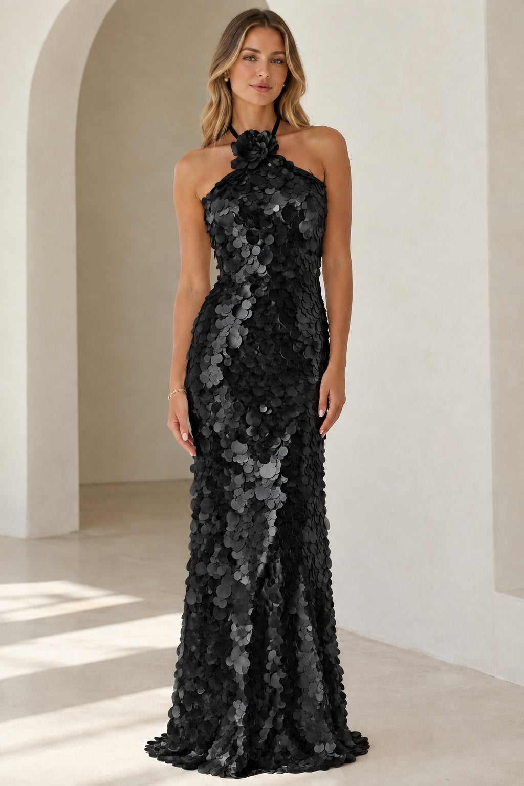 Front view of black floral halter sequin maxi dress