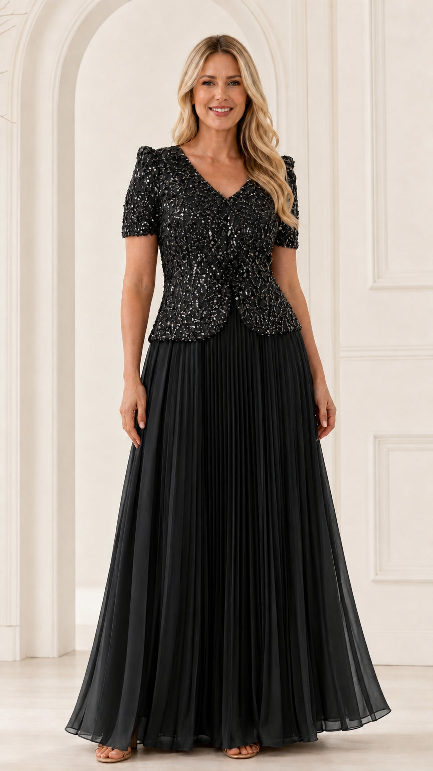 Full front view of classic black sequin V-neck formal maxi gown with pleated skirt
